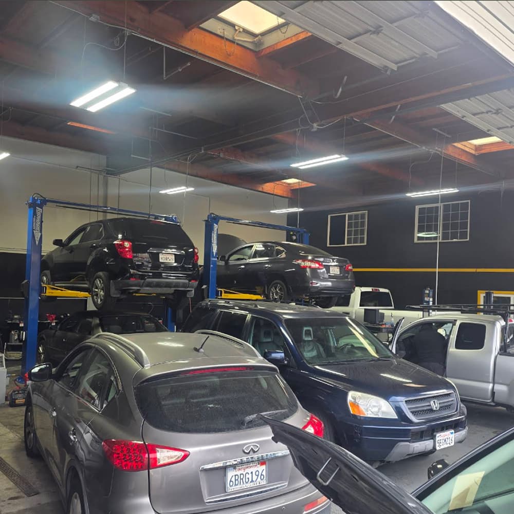 Technician performing detailed vehicle diagnostics