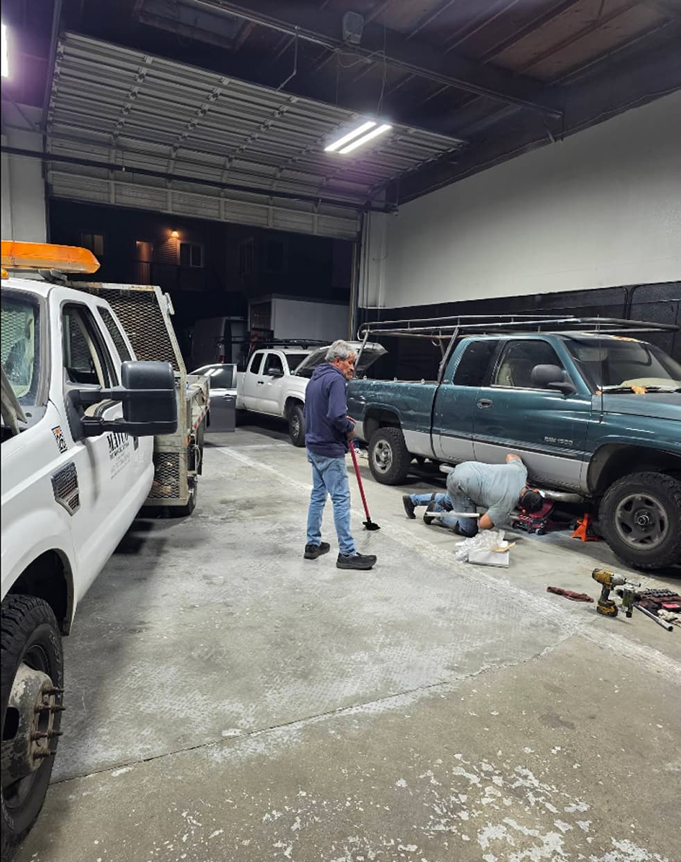 ASE-certified technician performing vehicle maintenance in the shop